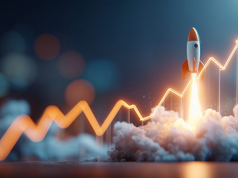 A rocket takes off with a financial chart showing growth and success, concept for startup venture, business development and investment growth.
